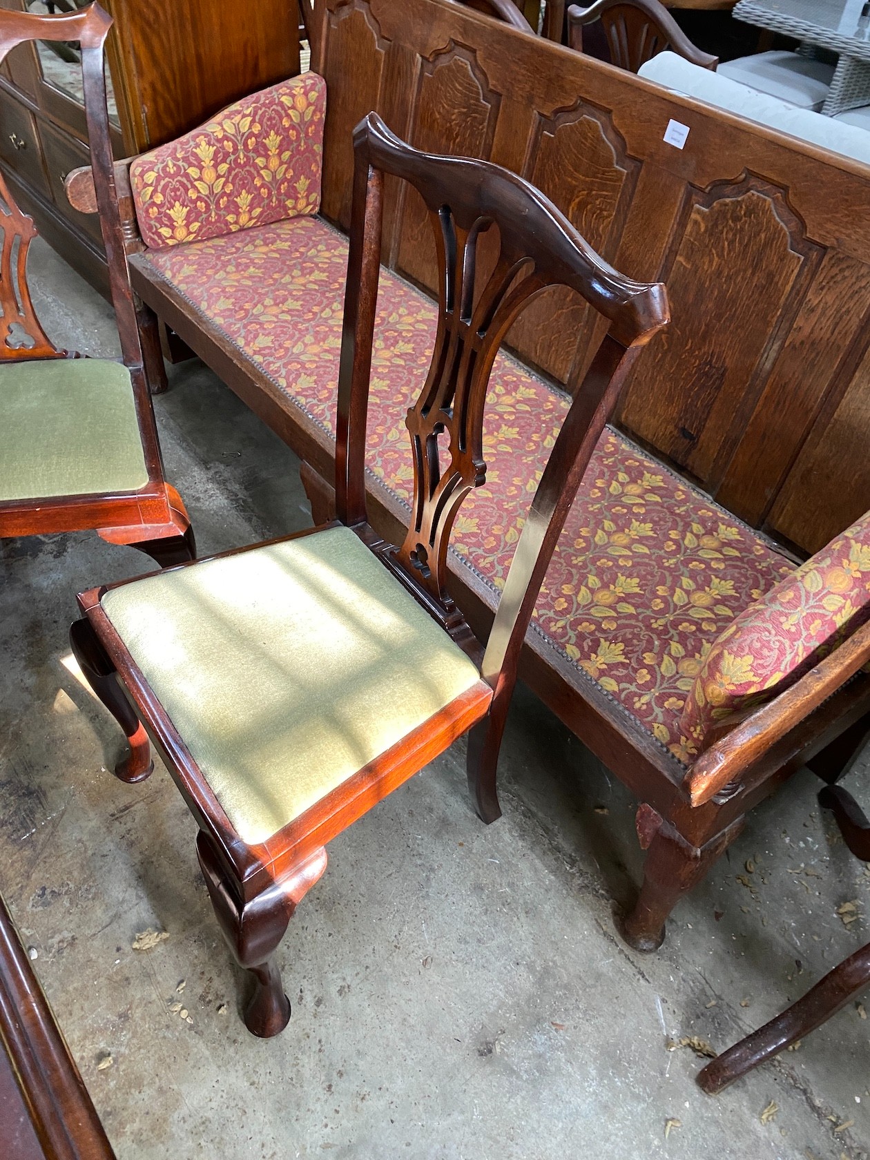 A set of four early 20th century Chippendale style mahogany dining chairs
